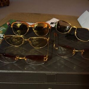 5 Cartier unisex sunglasses plus cases. The two vintage wooden ones need lens.